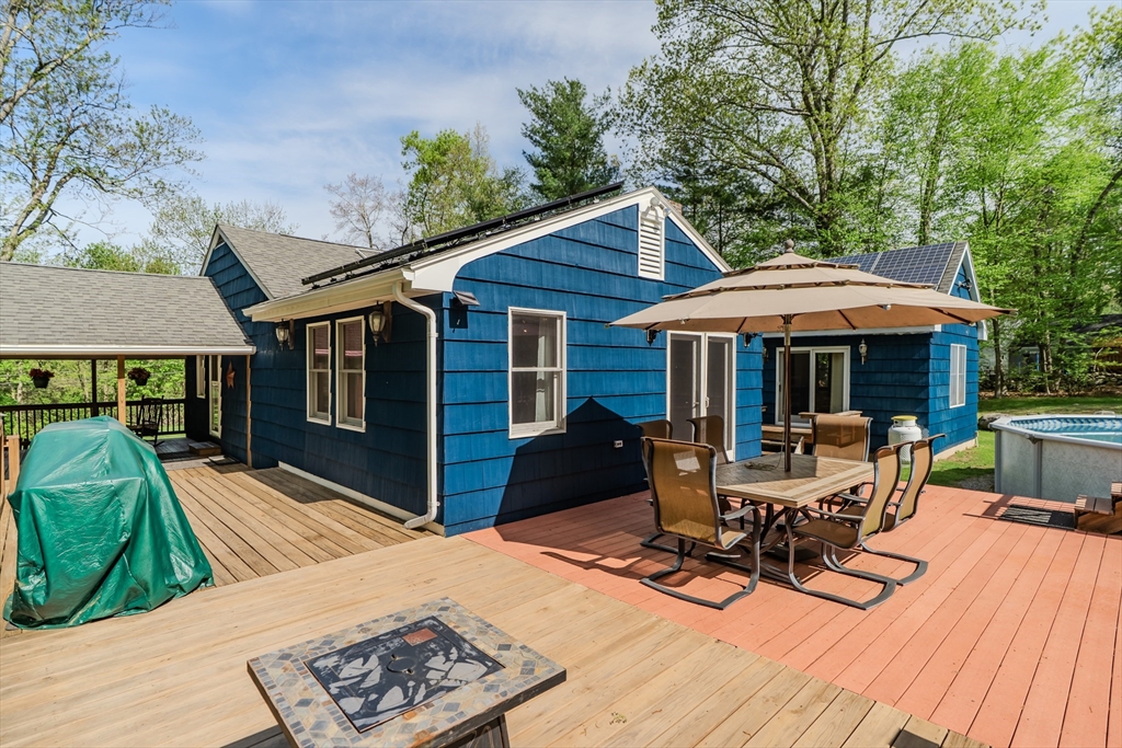 48 Ames Road Hampden, MA 01036 - Photo 12 of 42 a view of a house with backyard sitting area and sitting area