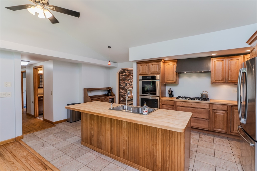 48 Ames Road Hampden, MA 01036 - Photo 25 of 42 a kitchen with stainless steel appliances a sink stove and cabinets