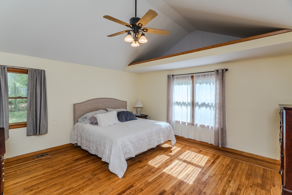 48 Ames Road Hampden, MA 01036 - Photo 32 of 42 a bedroom with a large bed and a window