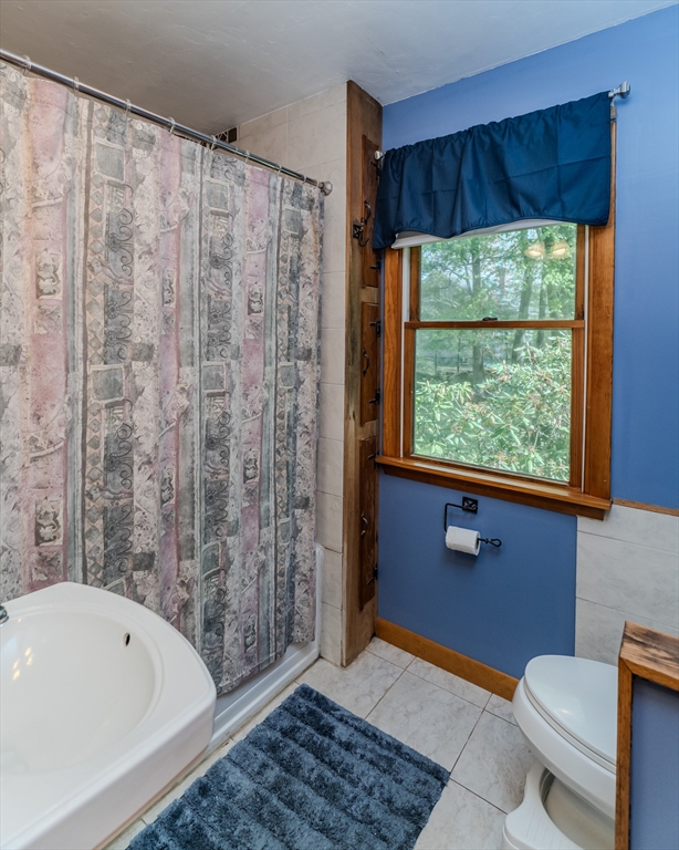 48 Ames Road Hampden, MA 01036 - Photo 35 of 42 a bathroom with a sink a bathtub and window