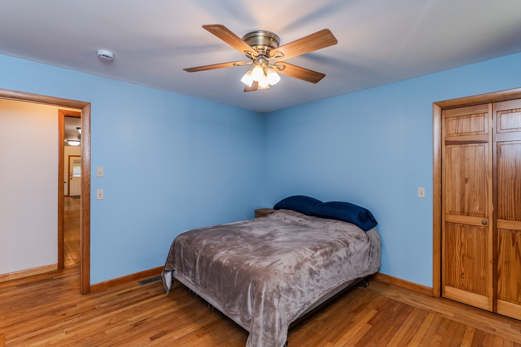 48 Ames Road Hampden, MA 01036 - Photo 37 of 42 a bedroom with a bed and a ceiling fan