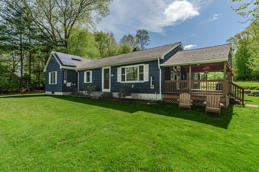 48 Ames Road Hampden, MA 01036 - Photo 5 of 42 a front view of a house with a garden and trees