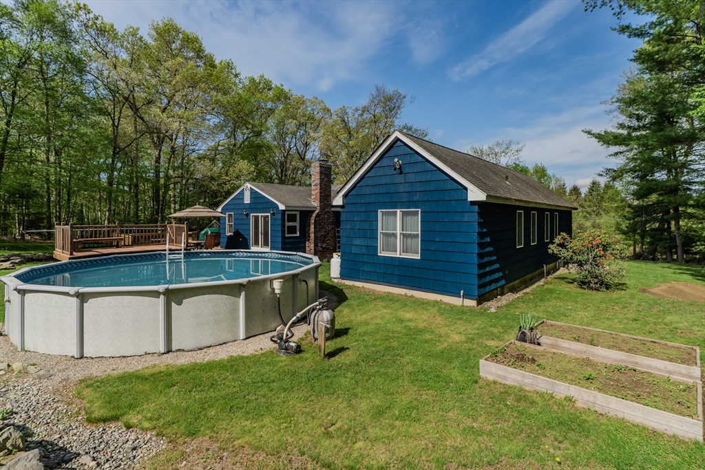 48 Ames Road Hampden, MA 01036 - Photo 10 of 42 a view of a house with a yard patio and a slide