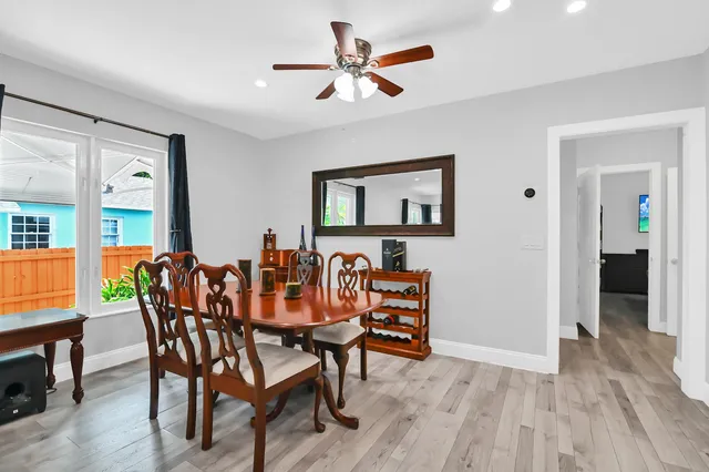 a dining room with furniture and window
