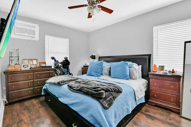 a bedroom with bed and a window