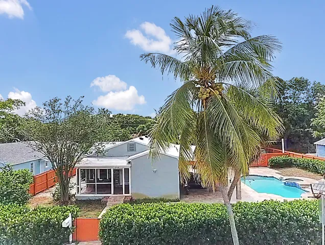 a view of a palm trees in front of a house