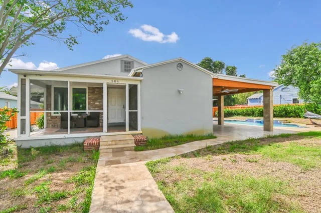 a front view of a house with garden