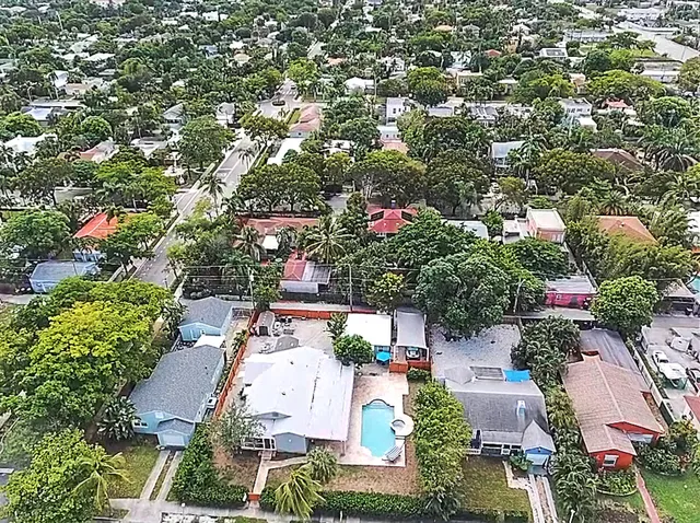 an aerial view of house with yard