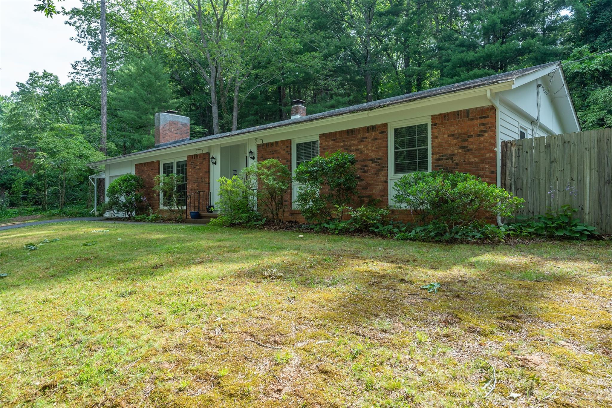 92 Alpine Way Asheville, NC 28805 - Photo 1 of 22 a view of a house with backyard and garden