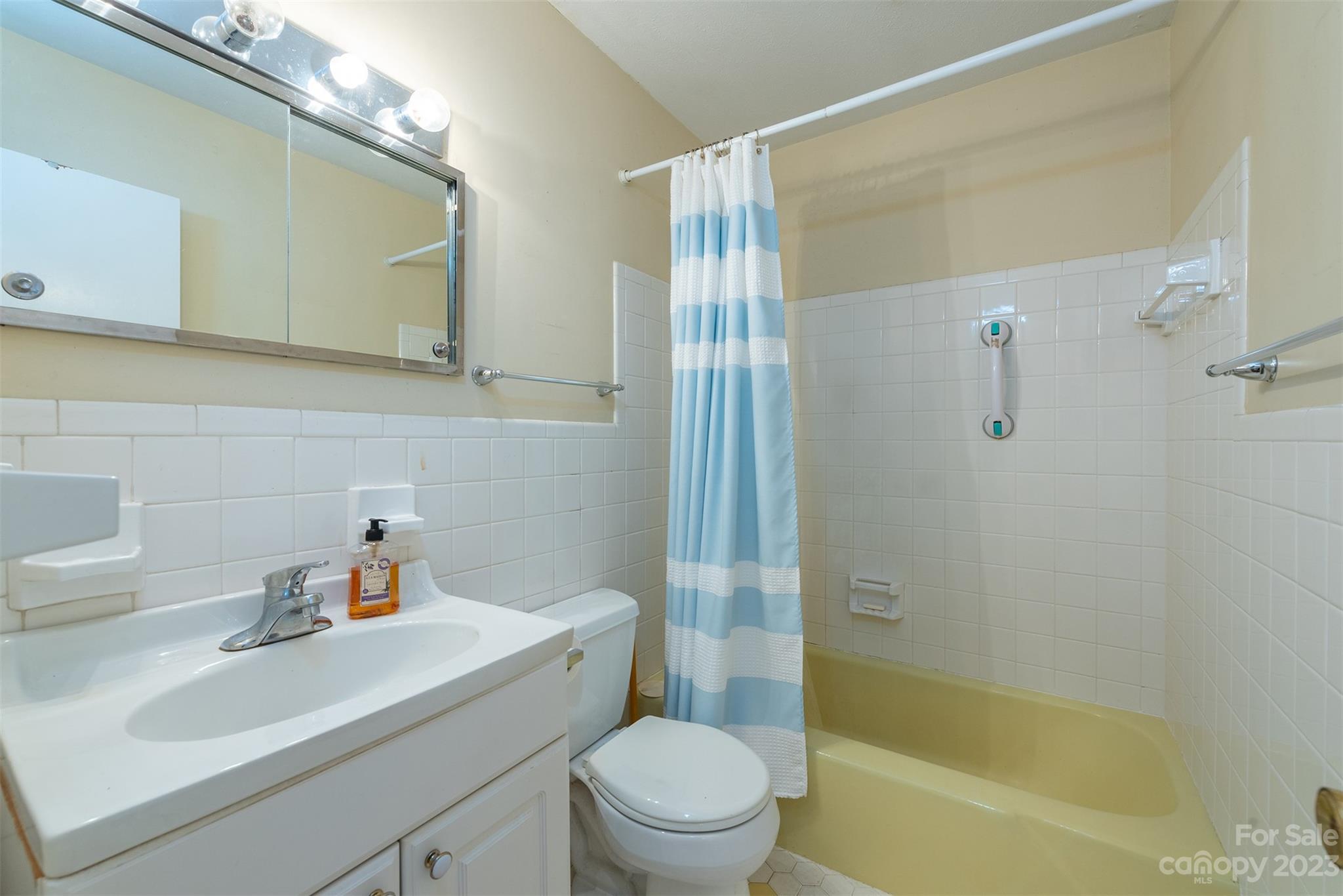 92 Alpine Way Asheville, NC 28805 - Photo 11 of 22 a bathroom with a sink a toilet and shower