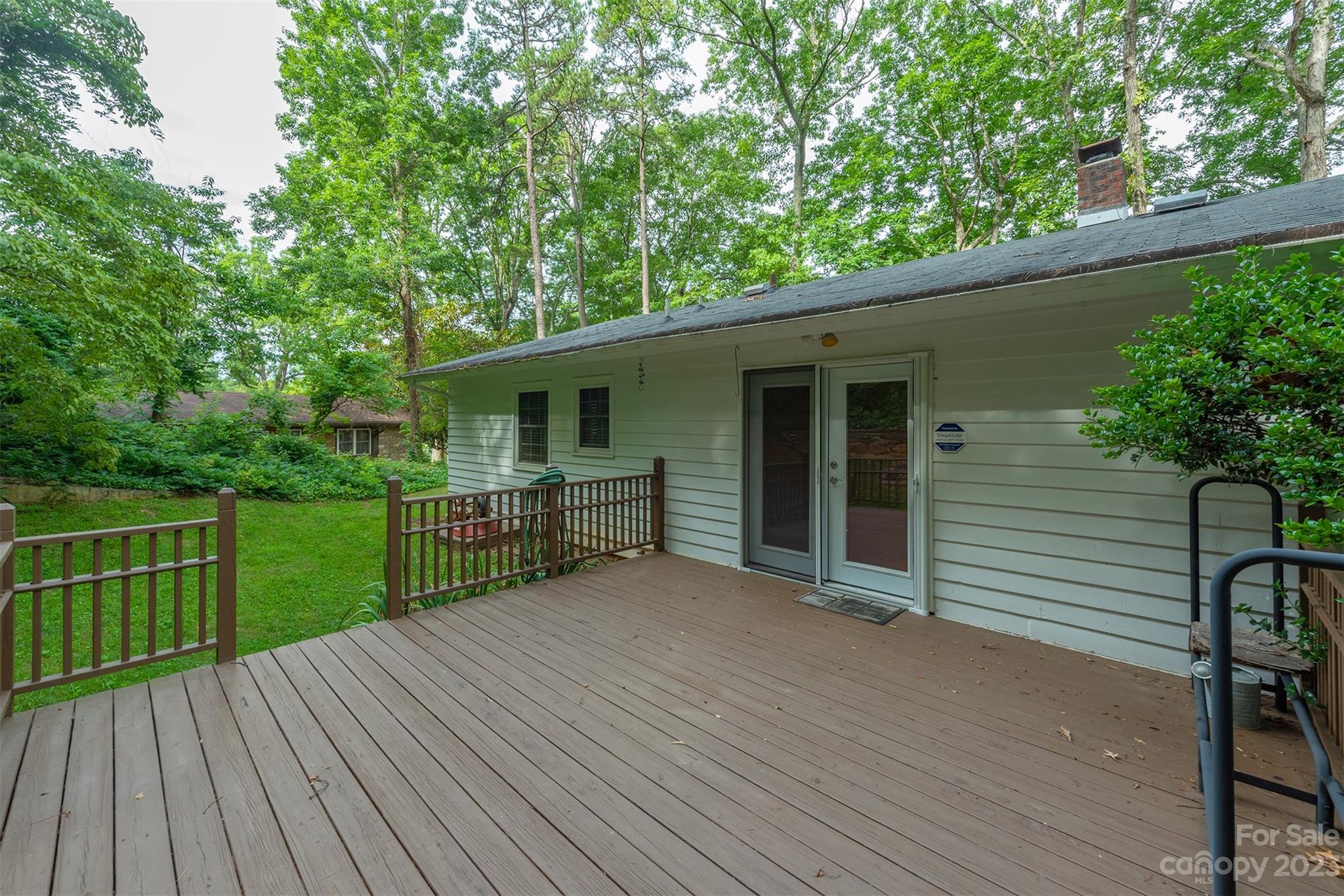 92 Alpine Way Asheville, NC 28805 - Photo 20 of 22 a view of a deck with a wooden floor and fence