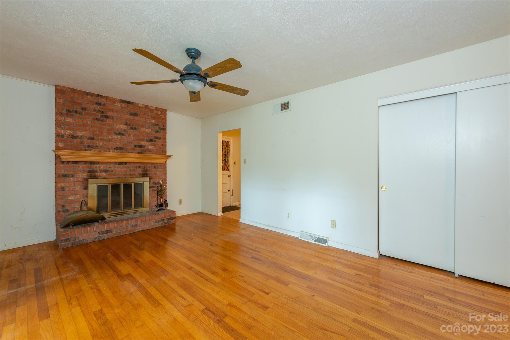 92 Alpine Way Asheville, NC 28805 - Photo 4 of 22 a view of a livingroom with a chandelier fan and wooden floor
