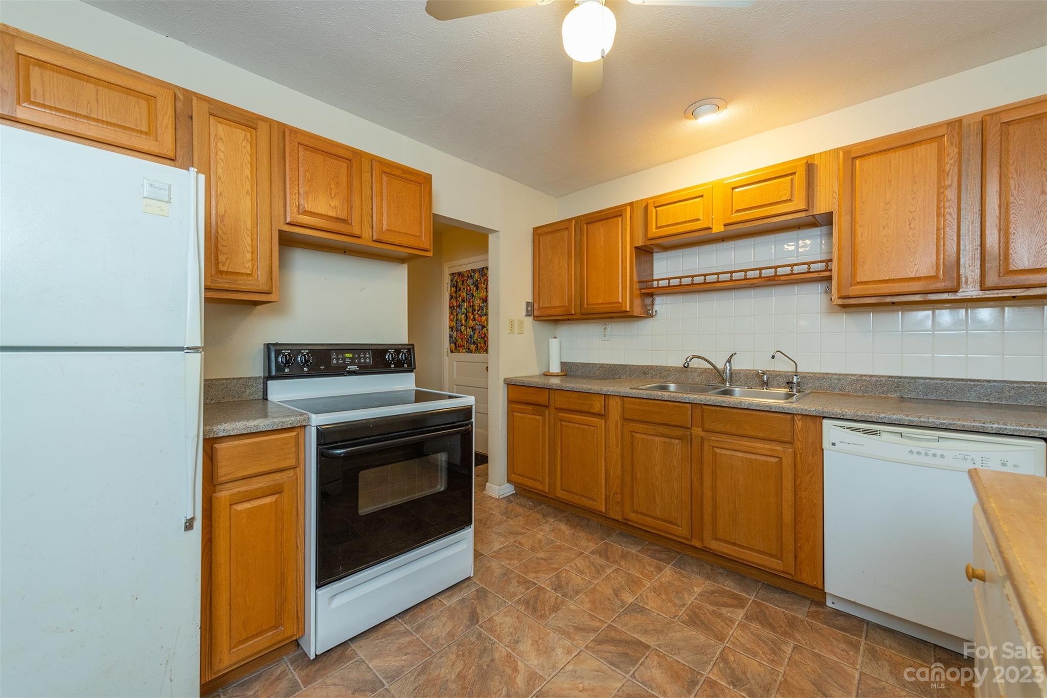 92 Alpine Way Asheville, NC 28805 - Photo 7 of 22 a kitchen with stainless steel appliances granite countertop a stove a sink and a refrigerator