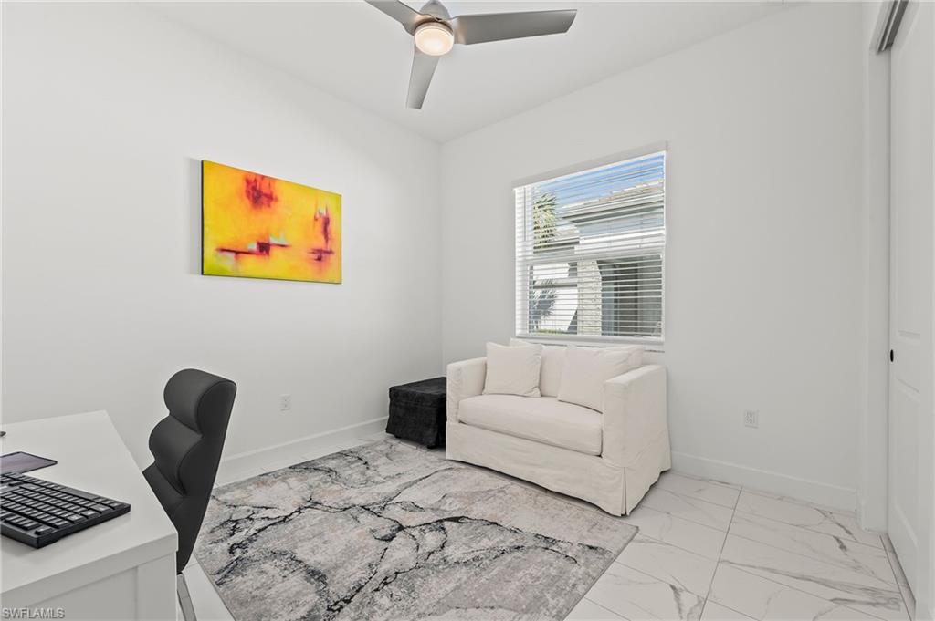 11488 Coronado Way Naples, FL 34120 - Photo 29 of 50 a living room with furniture and a window