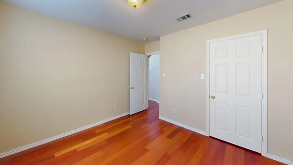 a view of room with wooden floor
