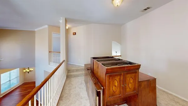 a view of a hallway with staircase