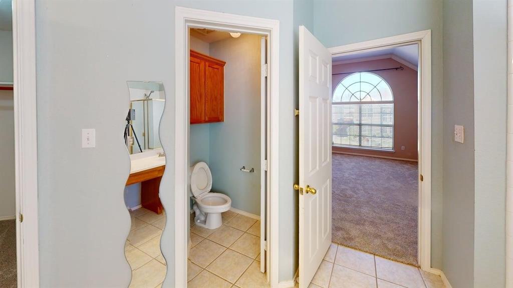 442 Spring Air Drive Allen, TX 75002 - Photo 20 of 27 a bathroom with a toilet and a shower