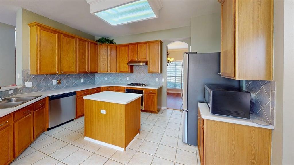 442 Spring Air Drive Allen, TX 75002 - Photo 3 of 27 a kitchen with stainless steel appliances granite countertop a stove a refrigerator a sink and dishwasher