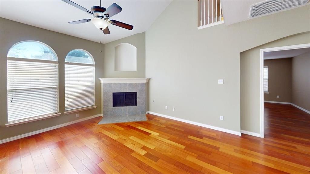 442 Spring Air Drive Allen, TX 75002 - Photo 5 of 27 a view of empty room with wooden floor and fan