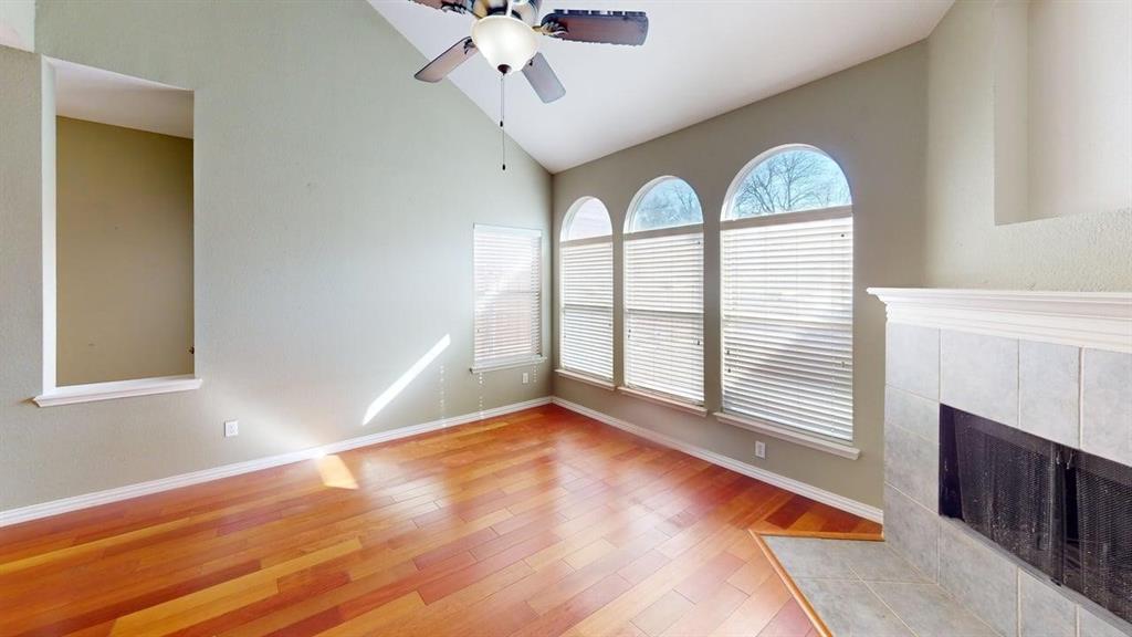 442 Spring Air Drive Allen, TX 75002 - Photo 6 of 27 a view of an empty room with wooden floor and a window