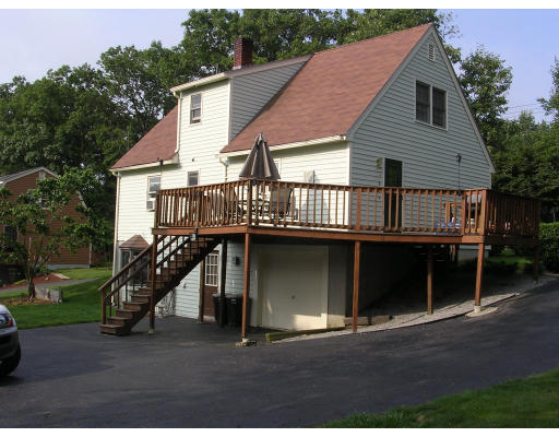 25 Wallace Road Sturbridge, MA 01566 - Photo 2 of 5 a front view of a house with a garage