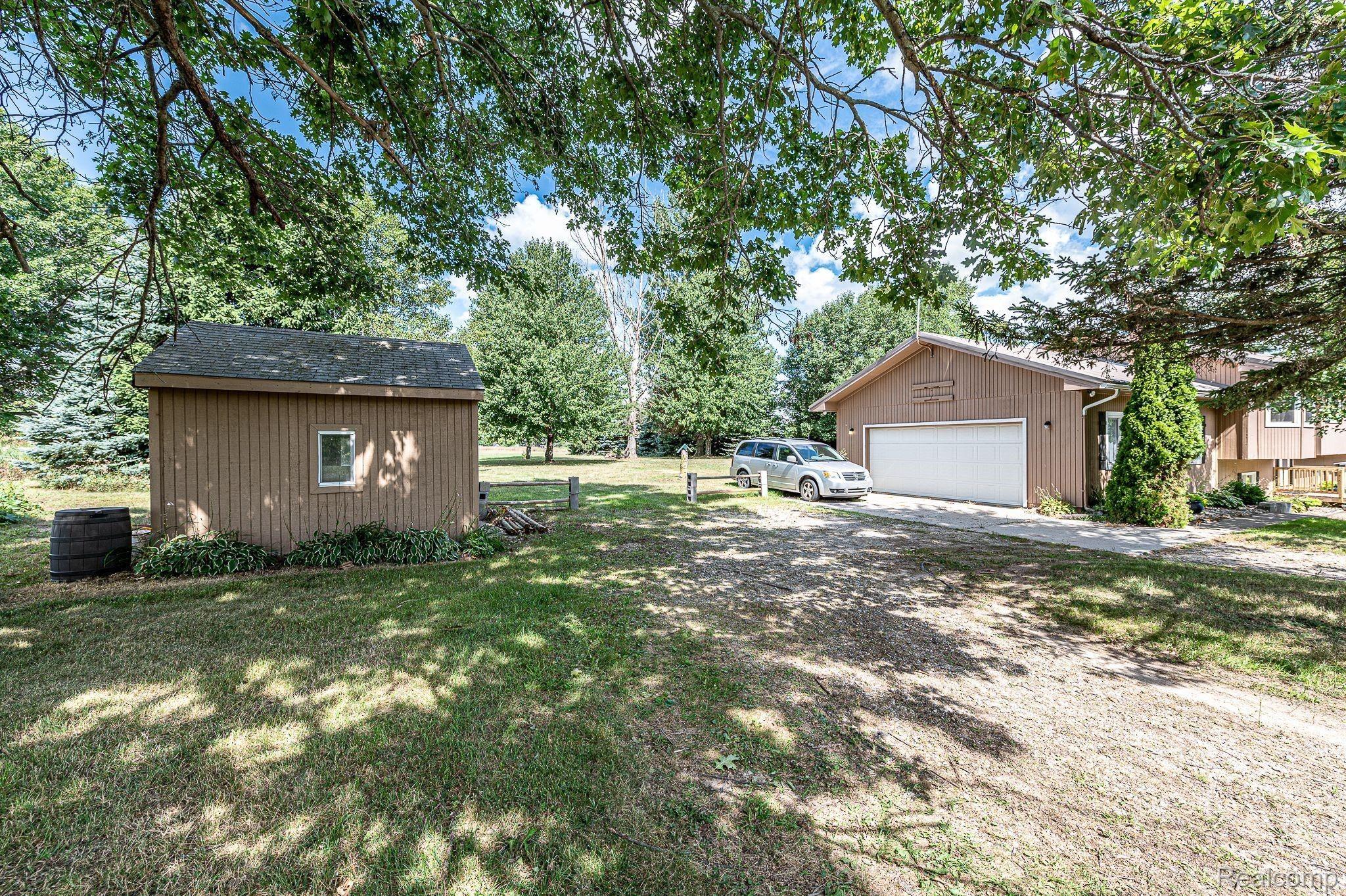 7881 Oak Grove Road Howell, MI 48855 - Photo 15 of 31 Driveway view with shed #2.jpeg