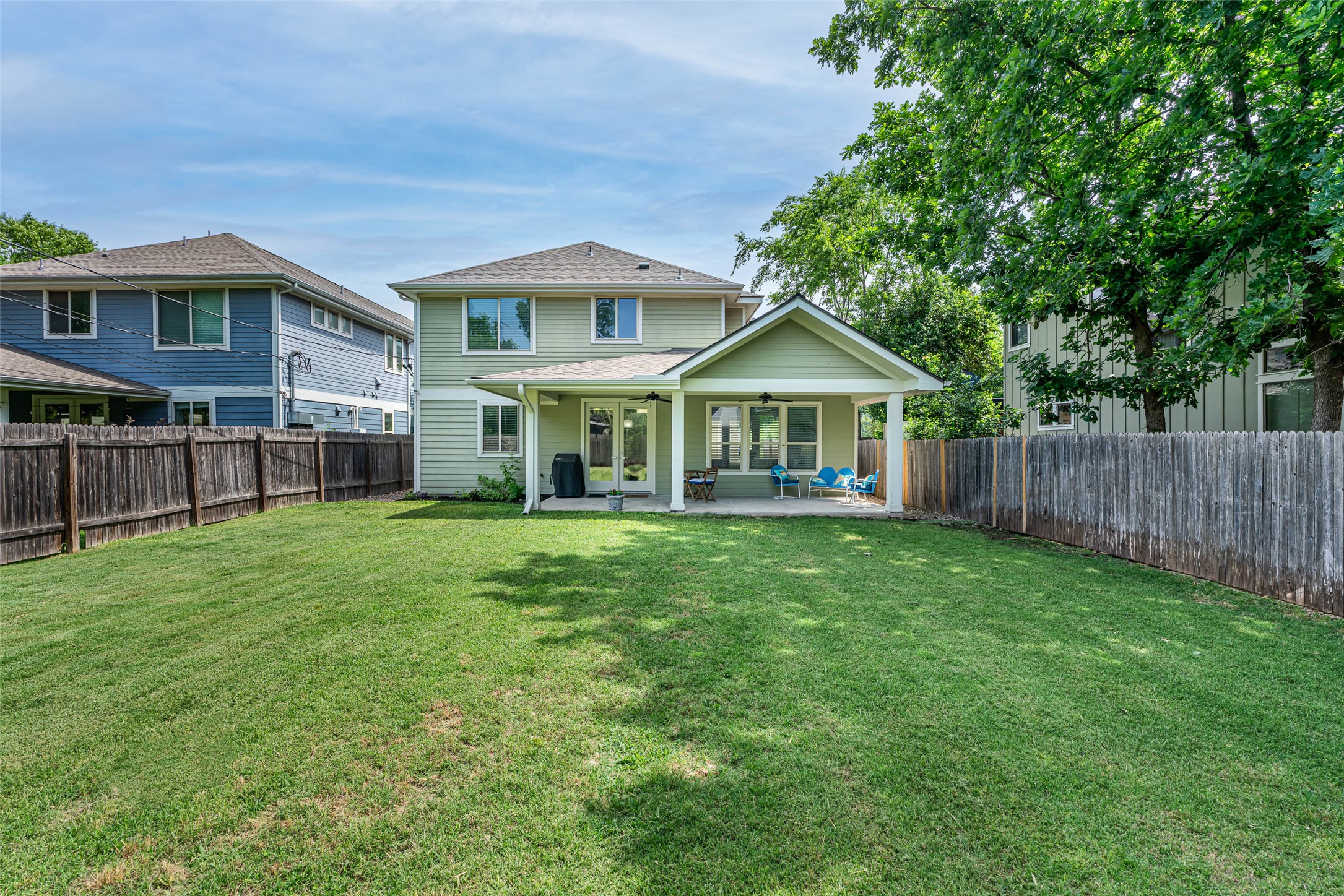 705 East 49th Street, Unit A Austin, TX 78751 - Photo 3 of 40 a front view of a house with yard and green space