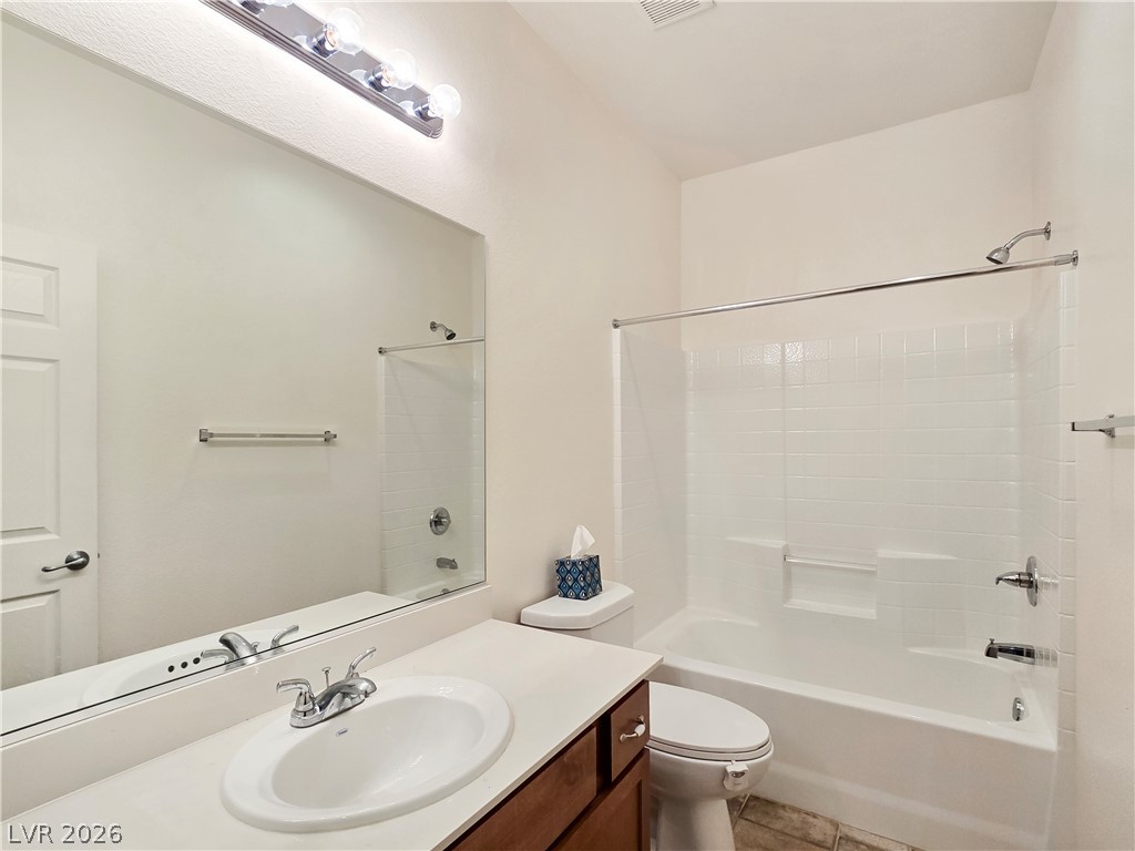 2485 Morrow Ridge Place Laughlin, NV 89029 - Photo 19 of 40 A well-appointed bath with a full vanity and a gleaming tub-shower combination.