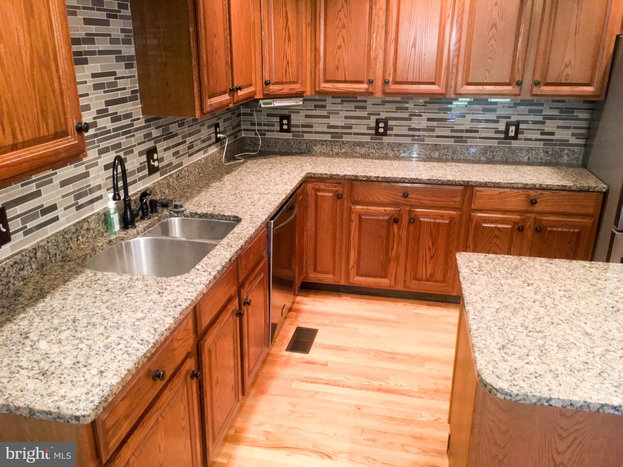 127 Holiday Road Cross Junction, VA 22625 - Photo 13 of 29 a kitchen with stainless steel appliances granite countertop a sink and a stove
