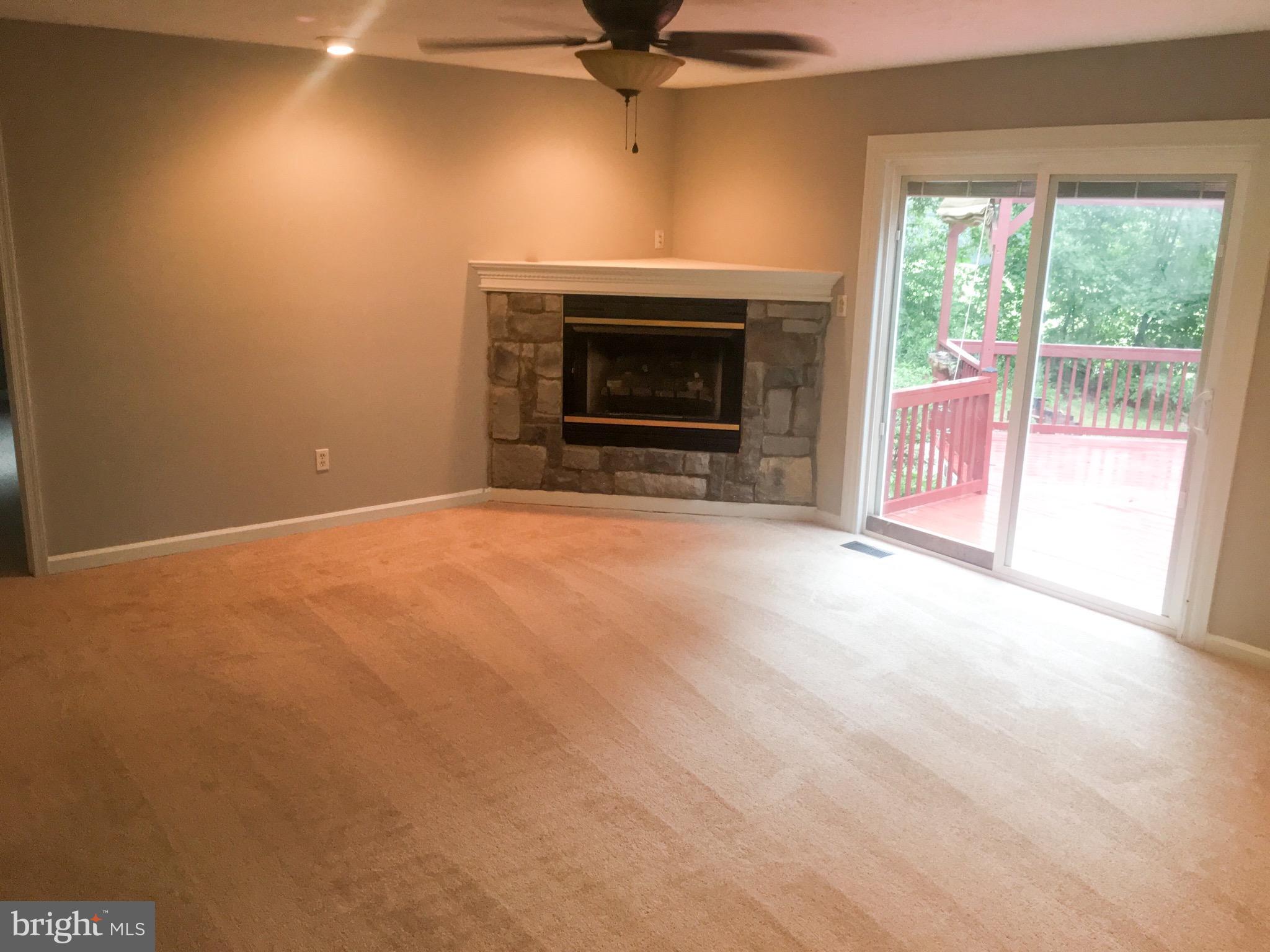 127 Holiday Road Cross Junction, VA 22625 - Photo 15 of 29 a view of empty room with a fireplace
