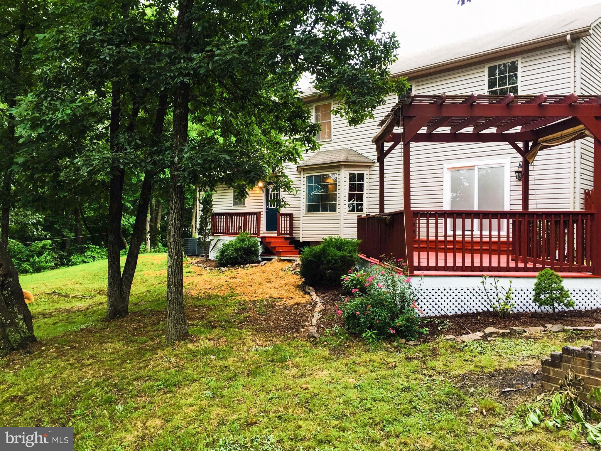 127 Holiday Road Cross Junction, VA 22625 - Photo 8 of 29 a front view of a house with garden