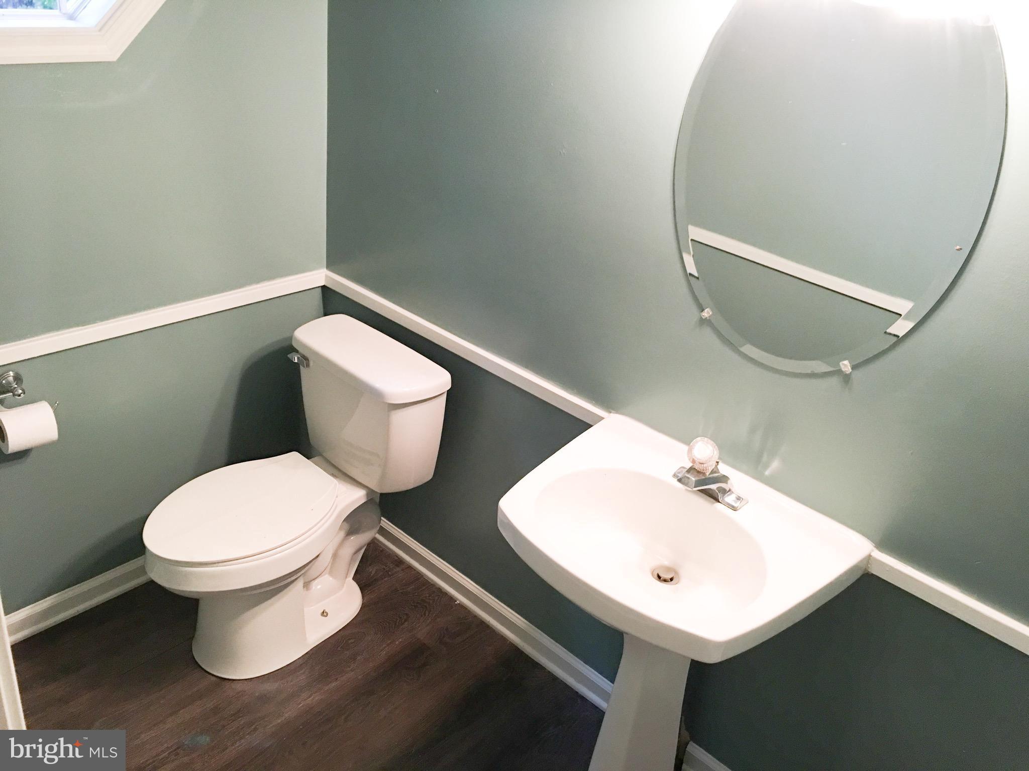 127 Holiday Road Cross Junction, VA 22625 - Photo 9 of 29 a bathroom with a toilet sink and mirror