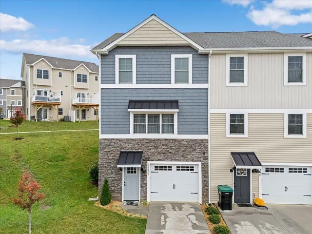 a front view of a house with a yard