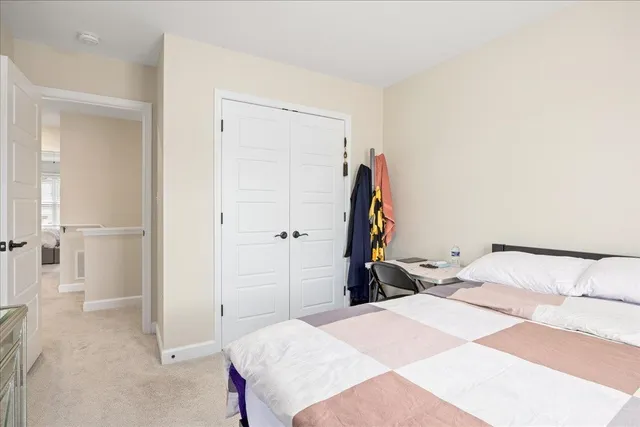 a bedroom with a bed and a bathroom