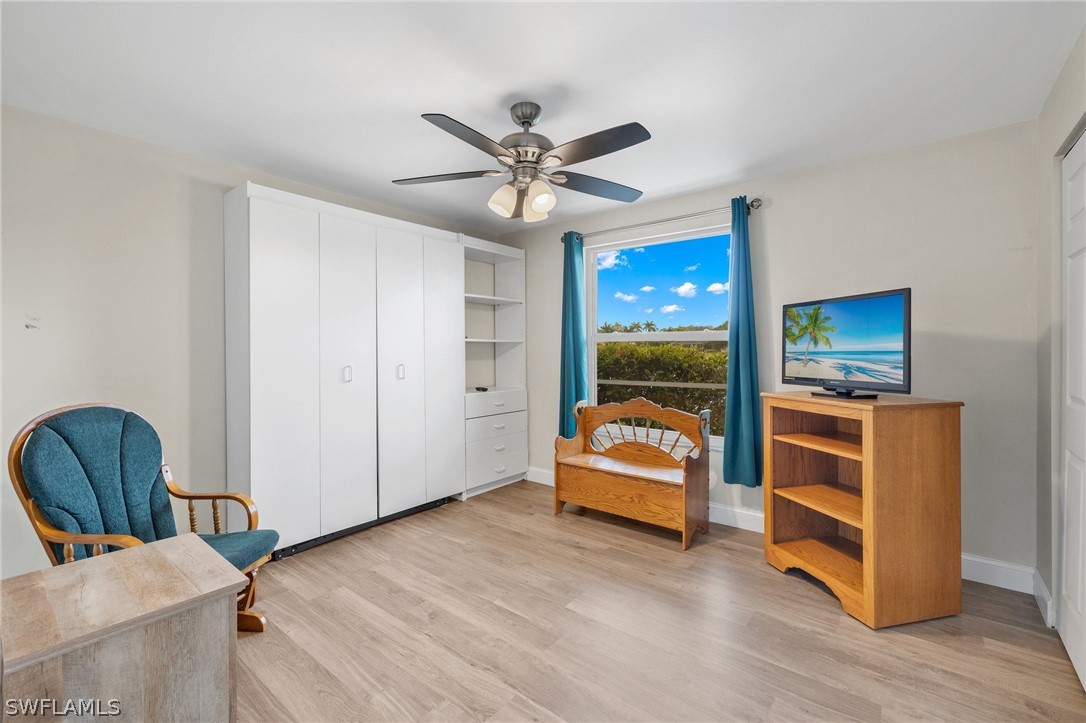 637 Windsor Square, Unit 102 Naples, FL 34104 - Photo 18 of 36 a view of a livingroom with furniture and a ceiling fan