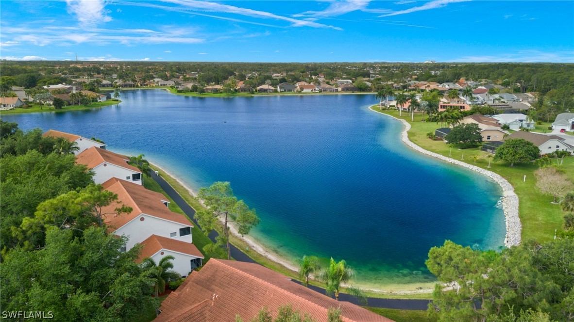 637 Windsor Square, Unit 102 Naples, FL 34104 - Photo 30 of 36 an aerial view of residential building with outdoor space lake view and mountain view