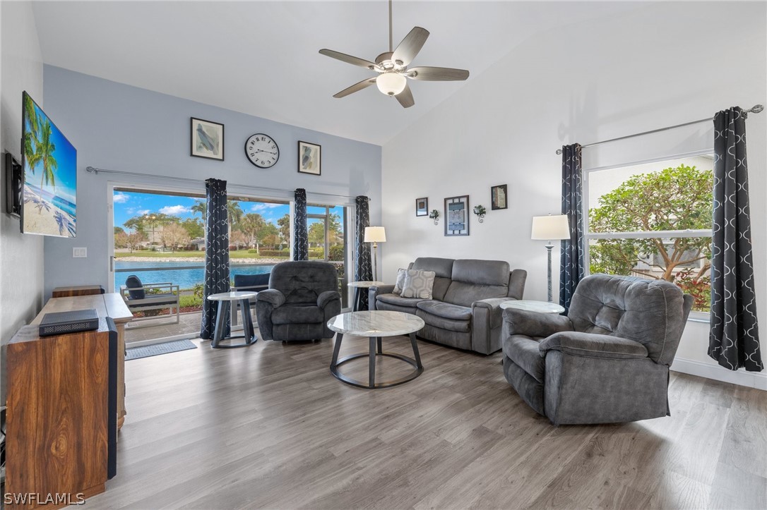 637 Windsor Square, Unit 102 Naples, FL 34104 - Photo 3 of 36 a living room with furniture and a large window