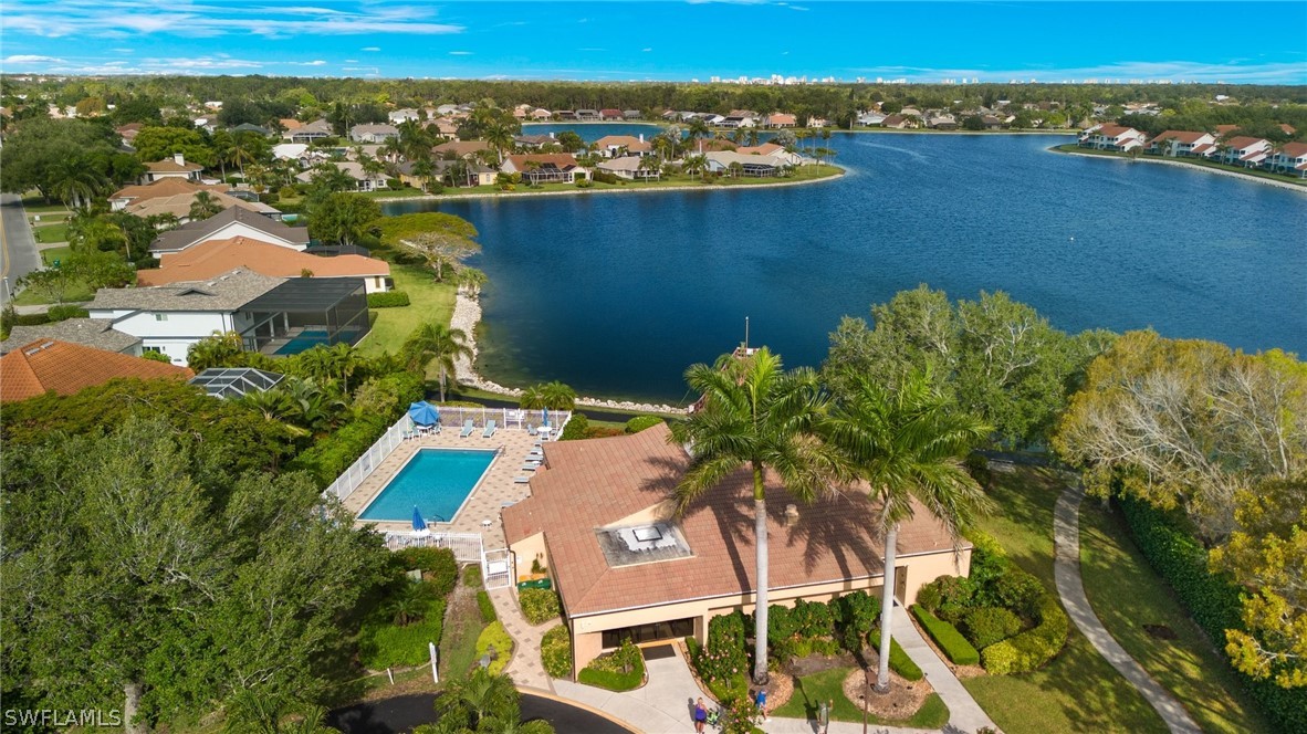 637 Windsor Square, Unit 102 Naples, FL 34104 - Photo 33 of 36 an aerial view of a house with a lake view