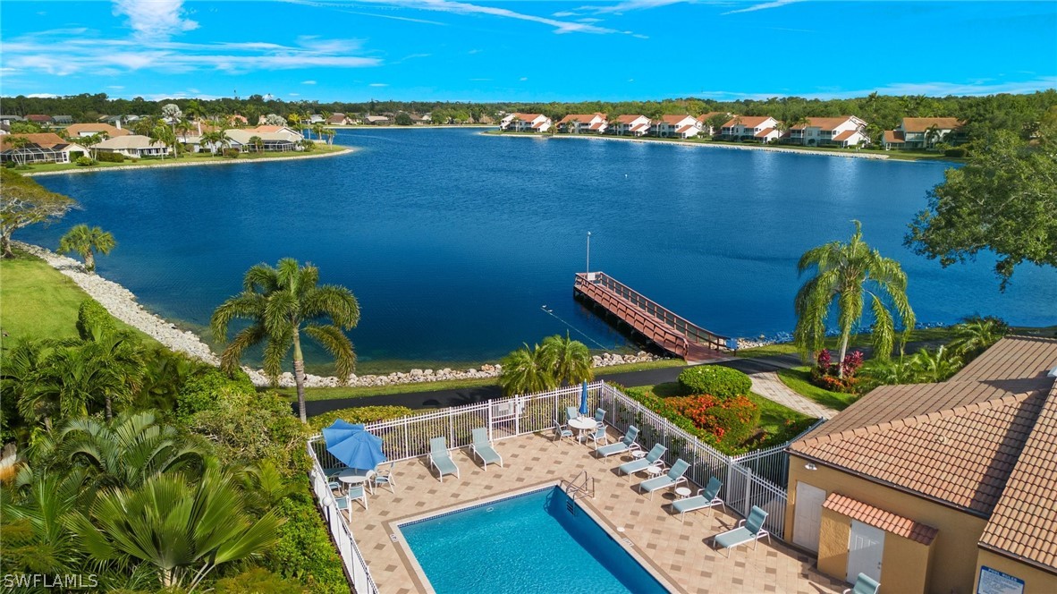 637 Windsor Square, Unit 102 Naples, FL 34104 - Photo 34 of 36 a view of a chairs and table on the terrace