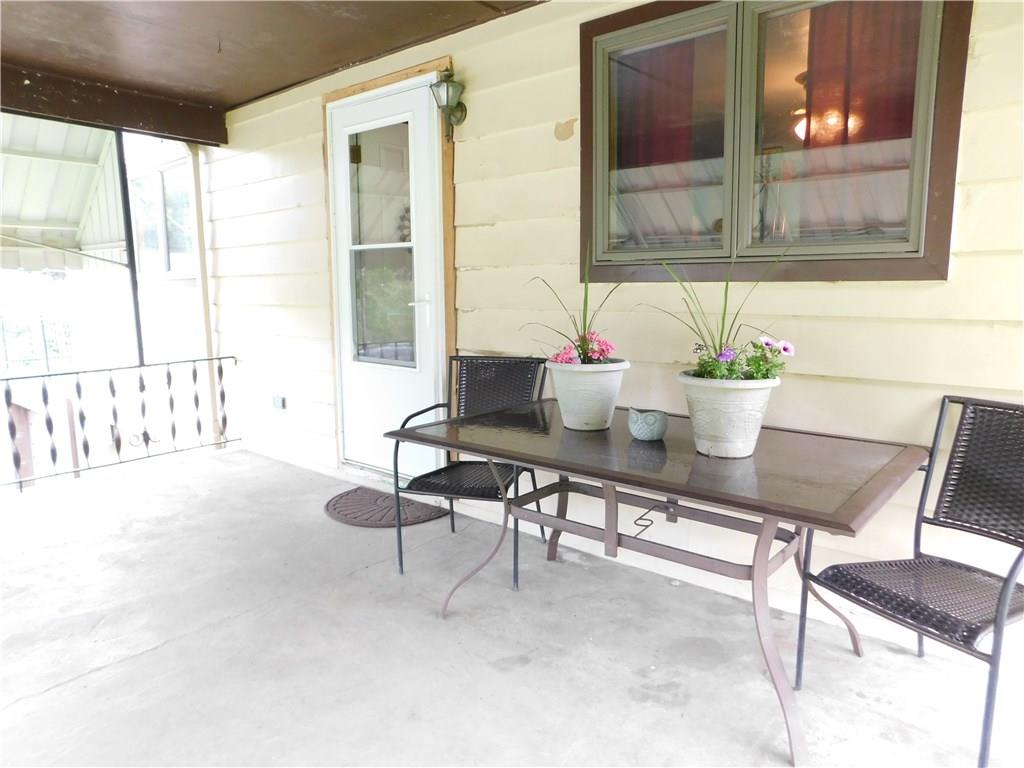 289 Grange Road Coal Center, PA 15423 - Photo 3 of 19 Nice front porch to sit and enjoy your morning coffee.