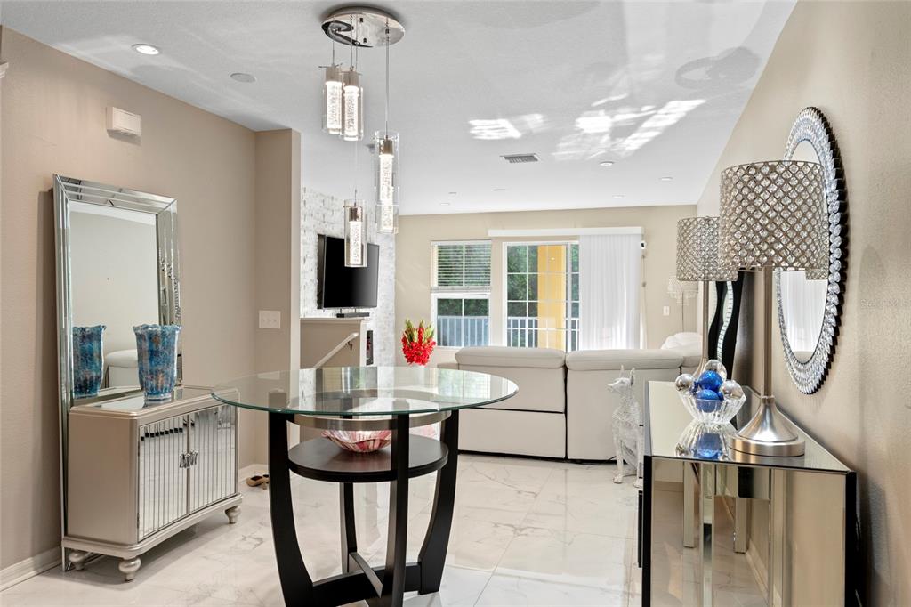 8825 White Sage Loop Lakewood Ranch, FL 34202 - Photo 11 of 33 a living room with furniture and a flat screen tv