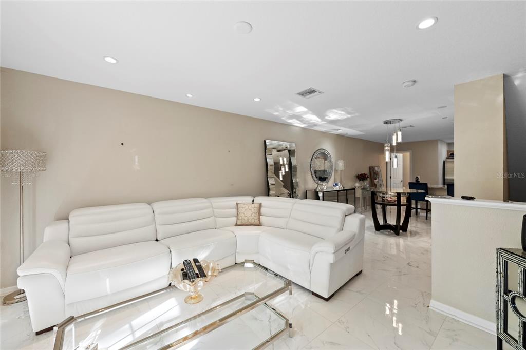 8825 White Sage Loop Lakewood Ranch, FL 34202 - Photo 2 of 33 a living room with furniture and white walls