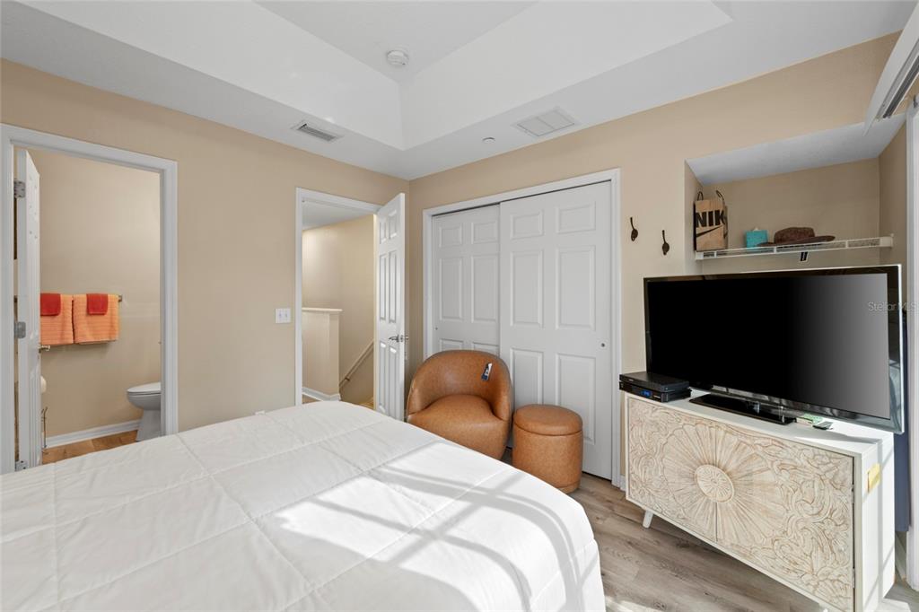 8825 White Sage Loop Lakewood Ranch, FL 34202 - Photo 21 of 33 a bedroom with a bed and a flat screen tv