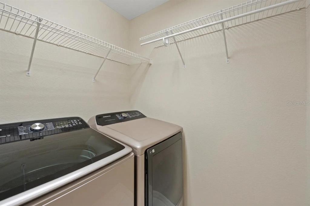 8825 White Sage Loop Lakewood Ranch, FL 34202 - Photo 29 of 33 a utility room with dryer and washer