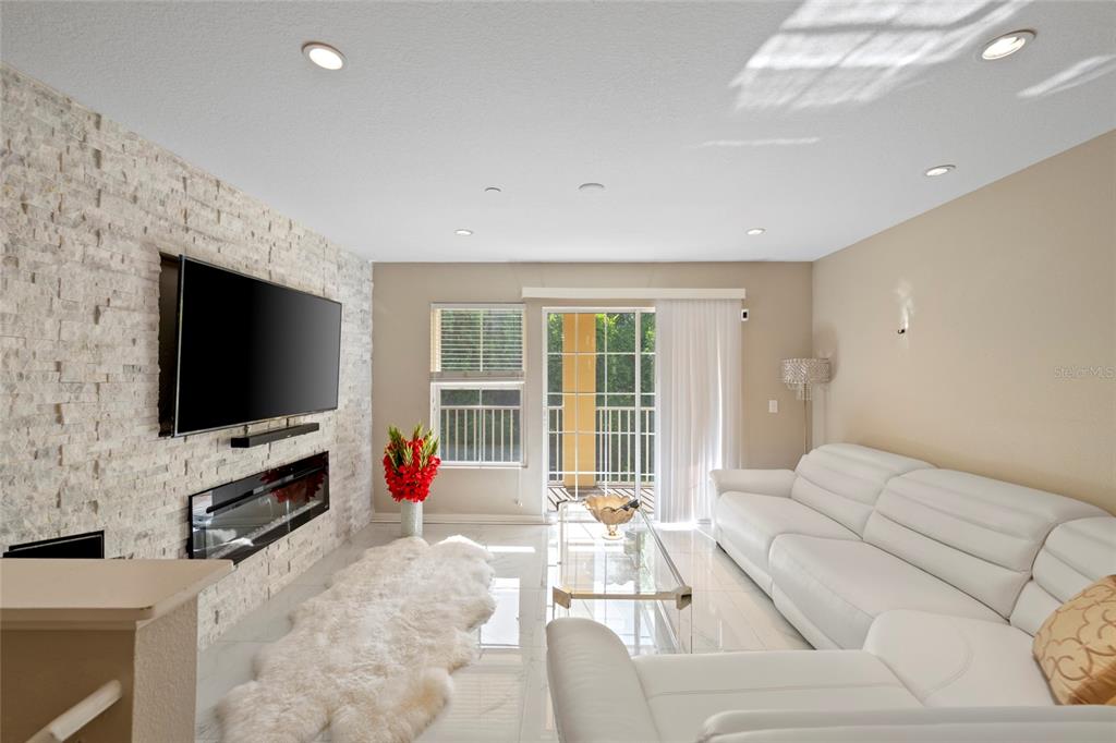 8825 White Sage Loop Lakewood Ranch, FL 34202 - Photo 5 of 33 a living room with furniture and a flat screen tv