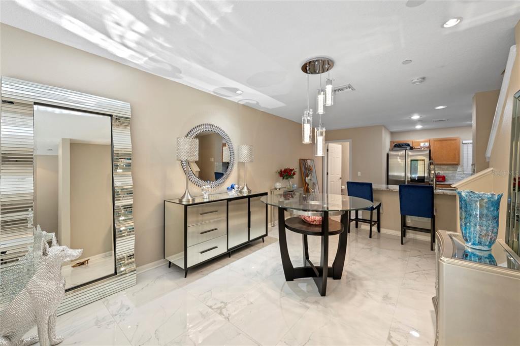 8825 White Sage Loop Lakewood Ranch, FL 34202 - Photo 6 of 33 a view of a dining room with furniture