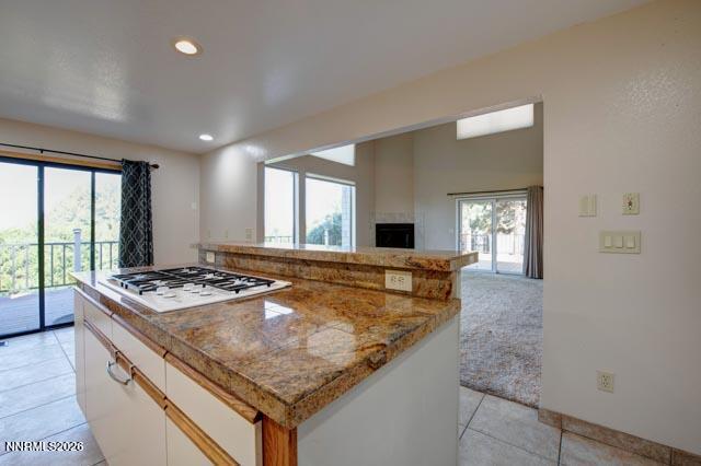 2640 Rockview Drive Reno, NV 89519 - Photo 22 of 56 a kitchen with kitchen island granite countertop lots of counter top space and stainless steel appliances