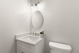 32 Barracks Road, Unit 32 Hudson, MA 01749 - Photo 13 of 16 a bathroom with a toilet sink and mirror