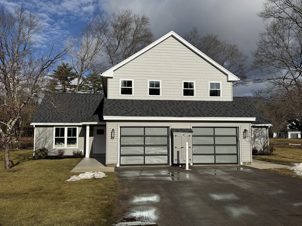 32 Barracks Road, Unit 32 Hudson, MA 01749 - Photo 16 of 16 a view of a house with a garage