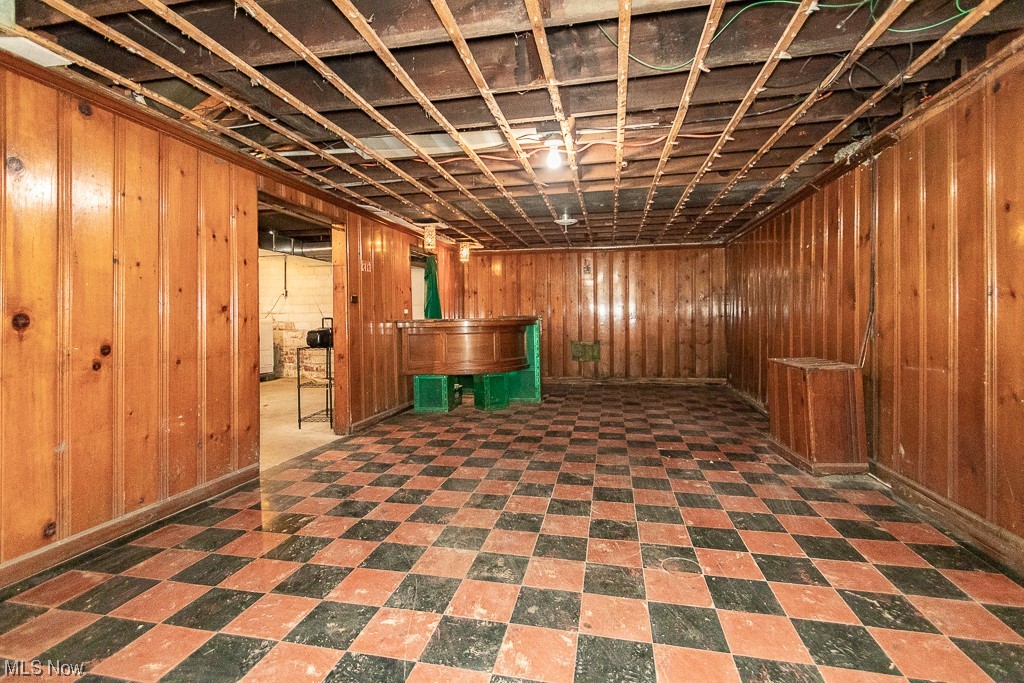 29396 Detroit Road Westlake, OH 44145 - Photo 30 of 30 Basement with panel walls and dark tile floors